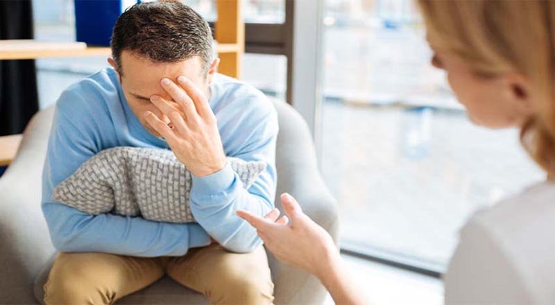 Client gesturing while talking with a counsellor during an individual counselling session